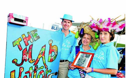 READY TO RELAY: The 2010 Mad Hatters team included Jarrod Bleijie, his mother Christine and Leah Stepto. They are holding a picture of Sgt Linden Bleijie, of the Australian ISF, their brother, son and partner, who was stationed in East Timor. The event did a live cross to him last year. READY TO RELAY: The 2010 Mad Hatters team included Jarrod Bleijie, his mother Christine and Leah Stepto. They are holding a picture of Sgt Linden Bleijie, of the Australian ISF, their brother, son and partner, who was stationed in East Timor. The event did a live cross to him last year.